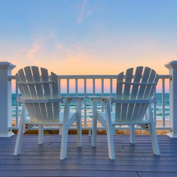 chairs on deck facing ocean